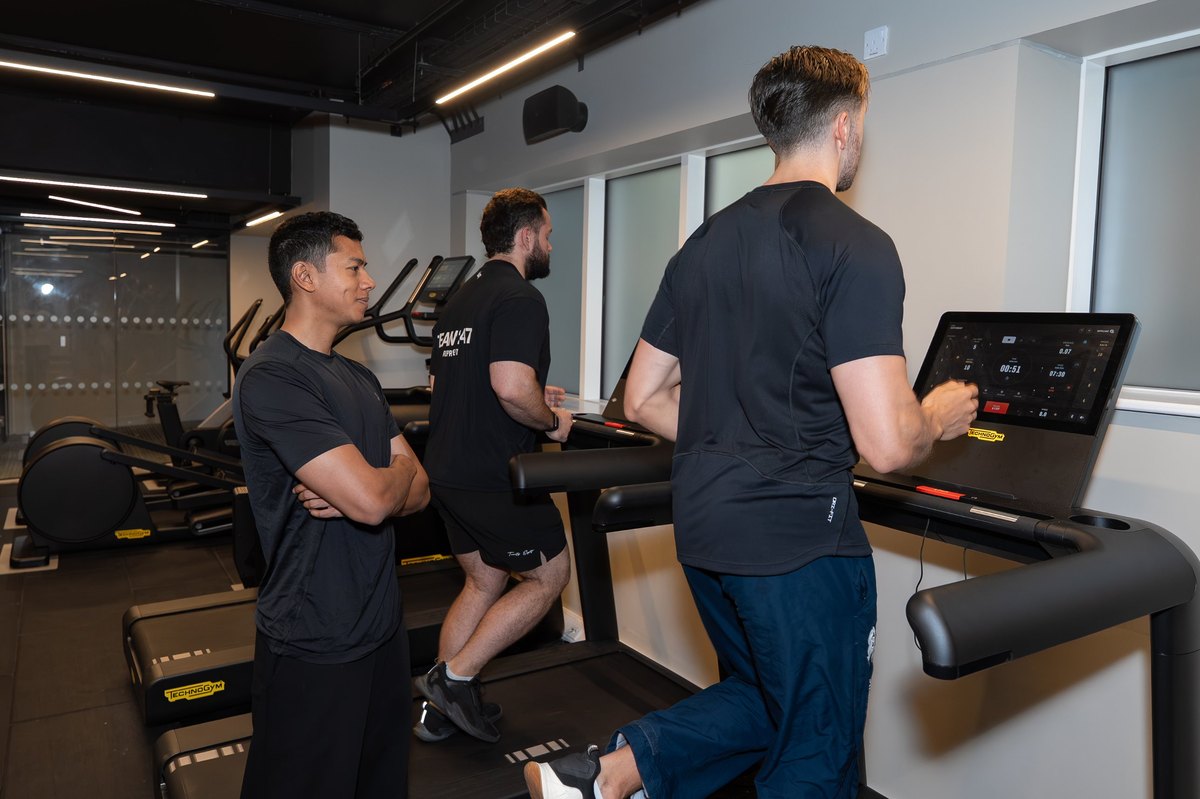 Joel Nathan watching patients run on treadmills during a return-to-training session