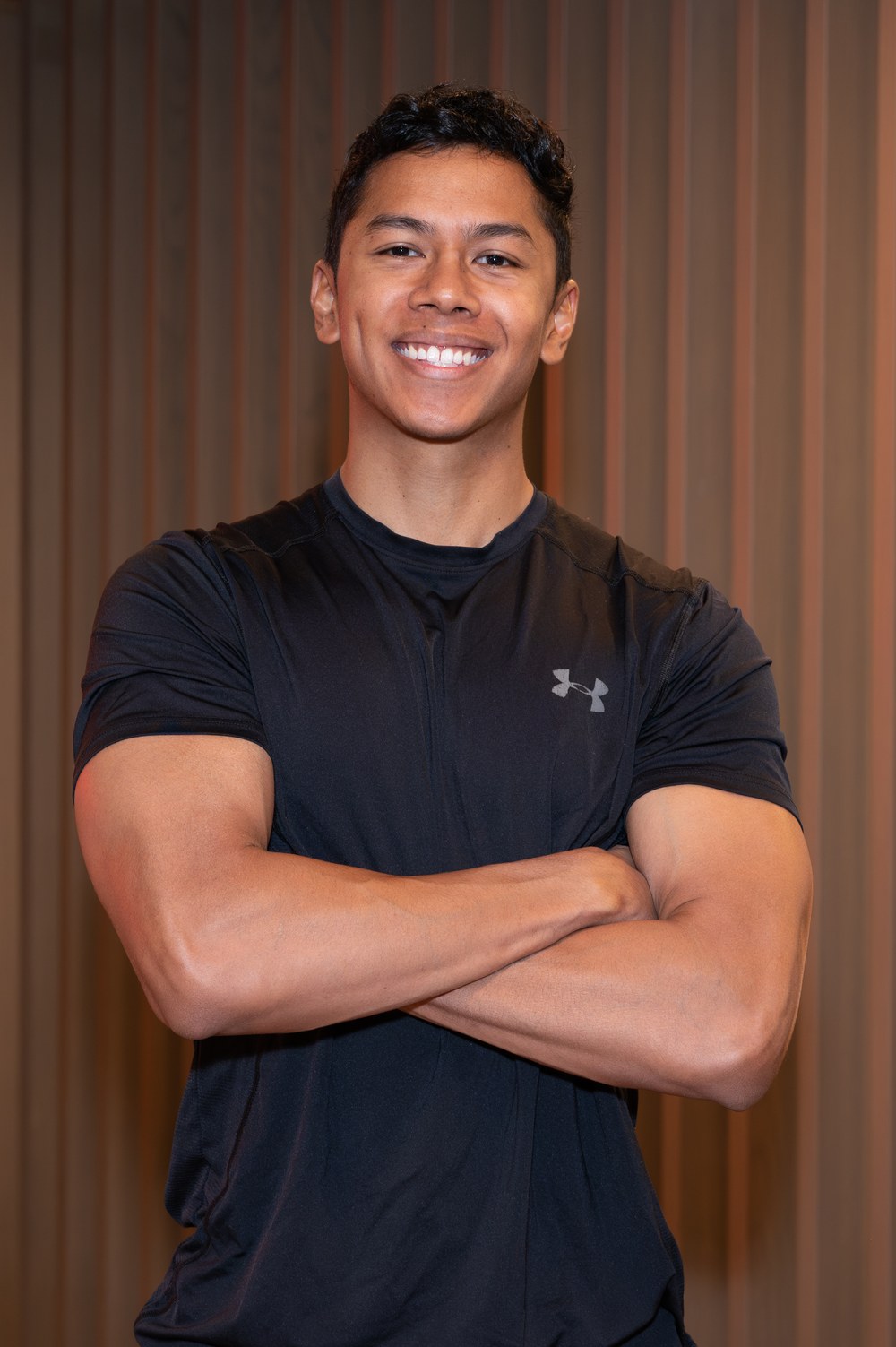 Joel Nathan, physiotherapist and personal trainer, coaching in the gym in Birmingham